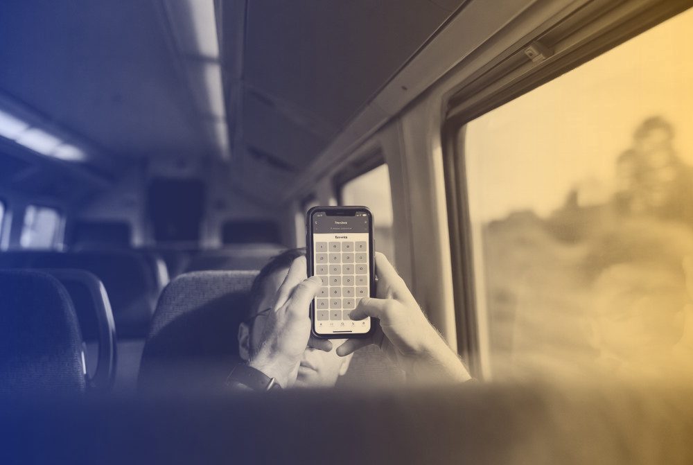Practising a quiz on a phone on the train